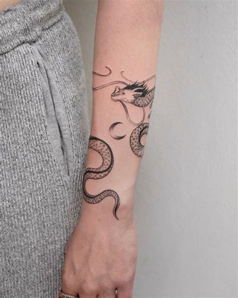 A Delicate Dragon That Wraps Around The Arm Swipe To See It In Action