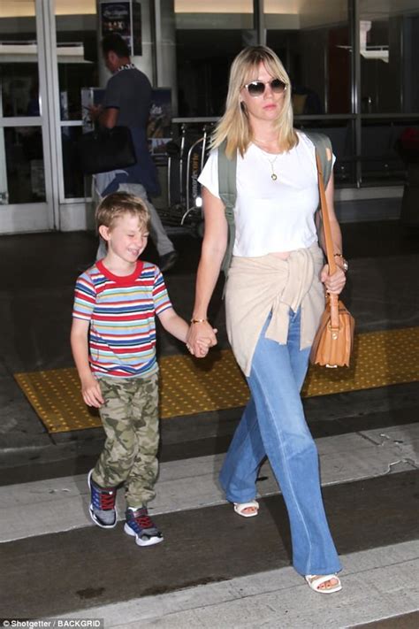 January Jones Rocks Denim As She And Xander Arrive At Lax Daily Mail Online