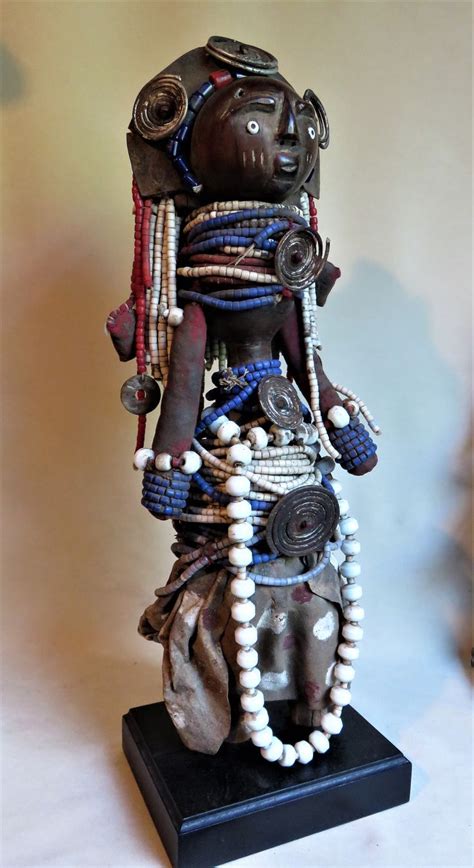 A Statue Made Out Of Beads And Other Items
