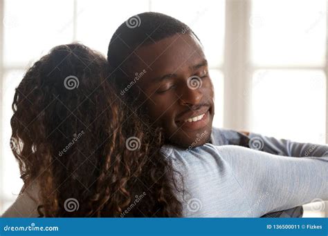 Happy Affectionate Black Husband Embracing Wife Enjoying Sincere Stock
