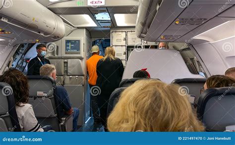People Waiting In An Allegiant Airplane At The Sanford International
