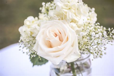 White Rose Wedding Centerpieces With Babys Breath In