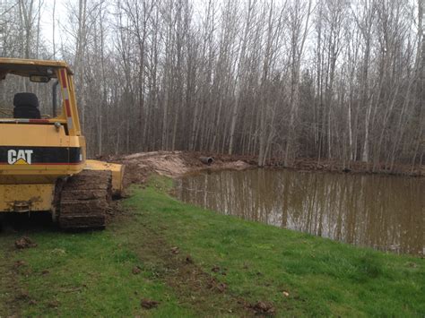 I have a very flat yard, completely flat. Gladwin,Michigan Pond pipe repair overflow
