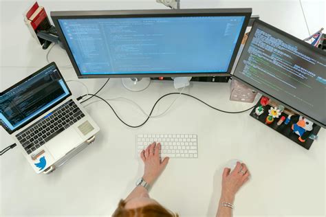 Female Software Engineer Coding on Computer · Free Stock Photo