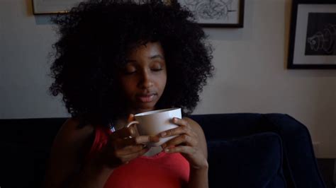 Young African American Woman Drinking Coffee Or Tea At Home Stock Video