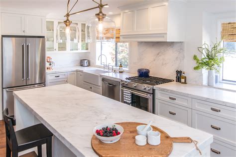 White Kitchen Cabinets With Carrera Marble Countertops