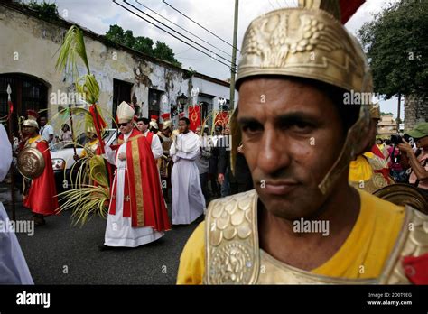 catholic faithful and a priest participate in the palm sunday procession in santo domingo april