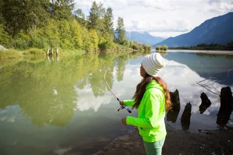 Indigenous Canadian Woman Salmon Fishing Photos By Canva