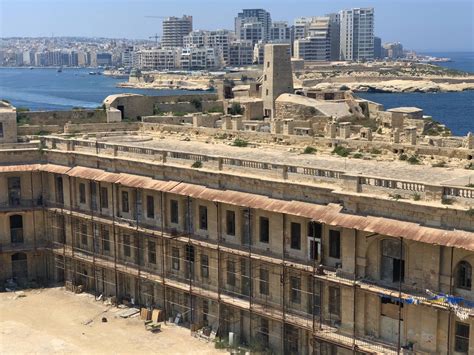 Abandoned Squats In Fort Stelmo Malta With Built Up Sliema In The