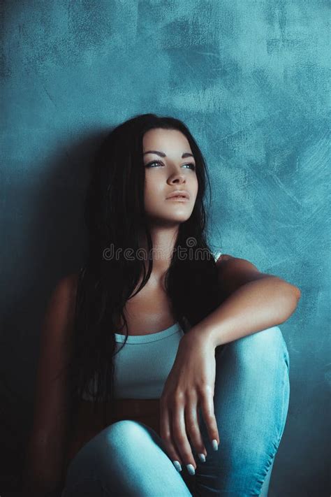 Beautiful Girl Sitting On The Floor Near The Wall Stock Image Image