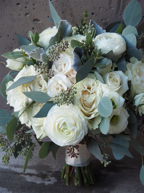 And this flower is one of the most popular for brides choosing their wedding bouquets. Ivory and white bridal bouquet with ranunculus, roses ...