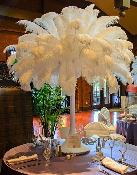 Full And Fabulous Tall Flowertower Centerpiece Using White Ostrich