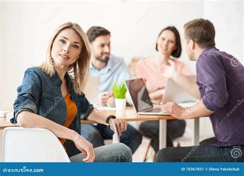 Cheerful Four Colleagues Are Working In Cooperation Stock Image Image