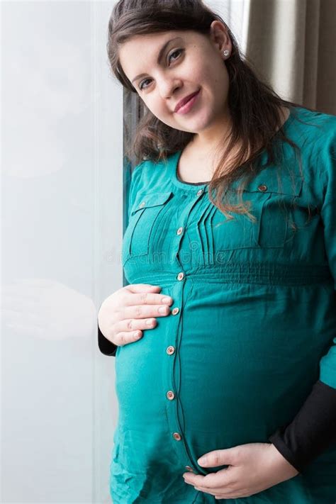 Smiling Expectant Mom Holding Her Budding Baby Bump Stock Image Image