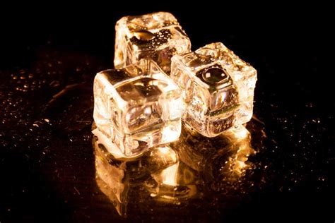 Gold Ice Cubes On Black Background Stock Image Image Of Crystal