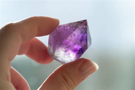Amethyst Crystal In Hand Purple Translucent Crystal Close Up Stock