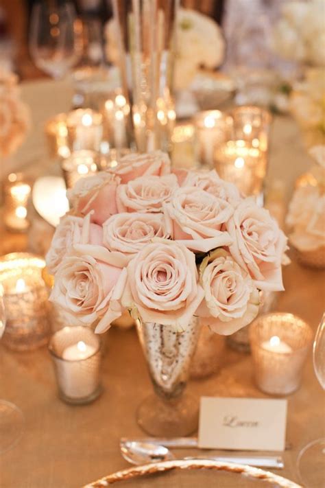picture of blush rose centerpiece in a gold vase