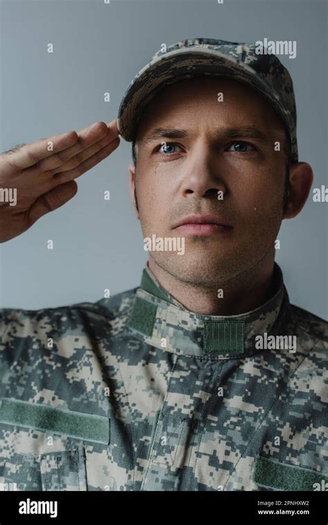 Sad Soldier In Military Uniform Crying And Saluting During Memorial Day