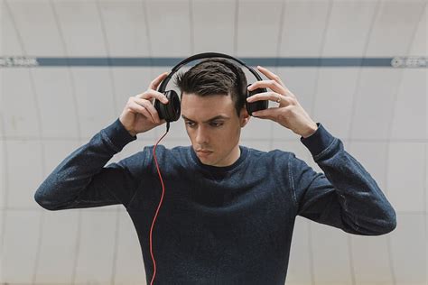 hd wallpaper photo of man about to wear headphones people guy sound music wallpaper flare