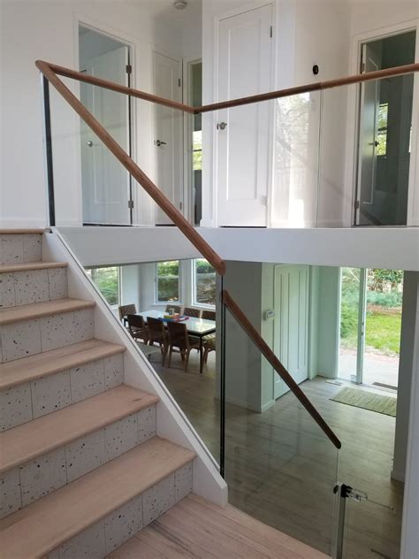 Minimal Glass Railing With A Wood Cap Rail Glass Railing Stairs