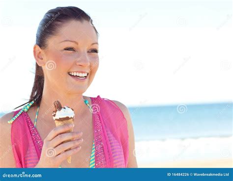 Joyful Woman In Bikini Eating Ice Cream On Beach Stock Photo Image Of