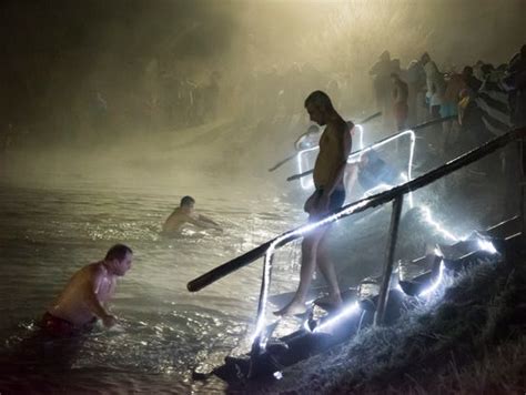Russians Celebrate Epiphany By Diving Into Freezing Waters