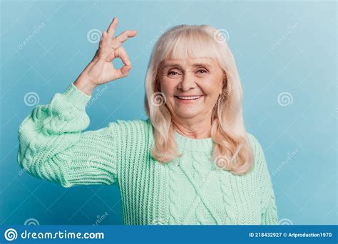 happy cheerful mature lady show okay sign isolated on blue background stock image image of