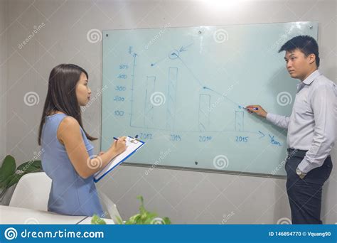 Asian Businessman Discussing With Colleagues In The Meeting Room Stock