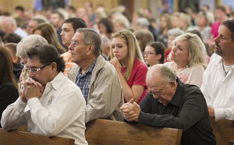 People Praying In Catholic Church