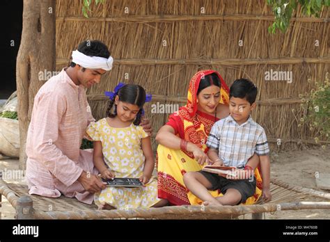 Indian Parents Teaching Their Children Stock Photo Alamy