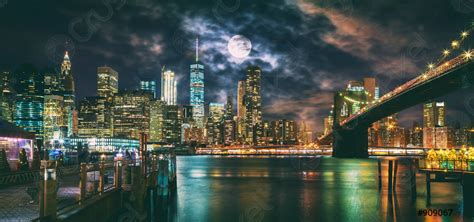 New York City Brooklyn Bridge And Manhattan Skyline Illuminated At