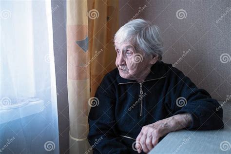 An Old Depressed Loneliness Woman In His House Looking At Nothing Help