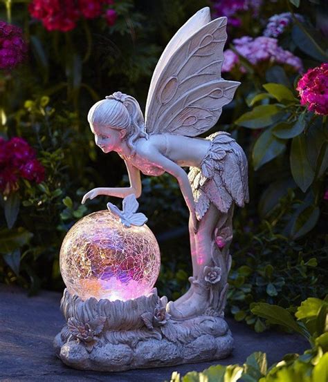 The sunflower fairy garden ornament is a charming fairy, crowned with a wreath of flowers and a petal skirt, lifts her sunflower bowl in this exquisitely detailed collectible fairy statue created exclusively for toscano. Solar Light Globe Fairy Statue Color Changing Angel Garden ...