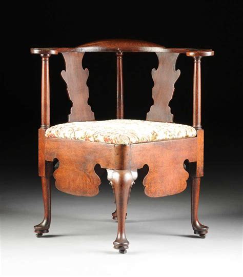 An English Queen Anne Mahogany Corner Or Roundabout