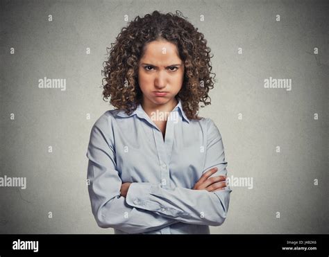 Closeup Portrait Of Angry Young Woman Puffing Cheeks Isolated On Grey