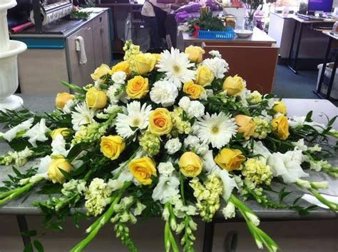 White And Yellow Casket Spray Funeral Flowers Funeral Arrangements