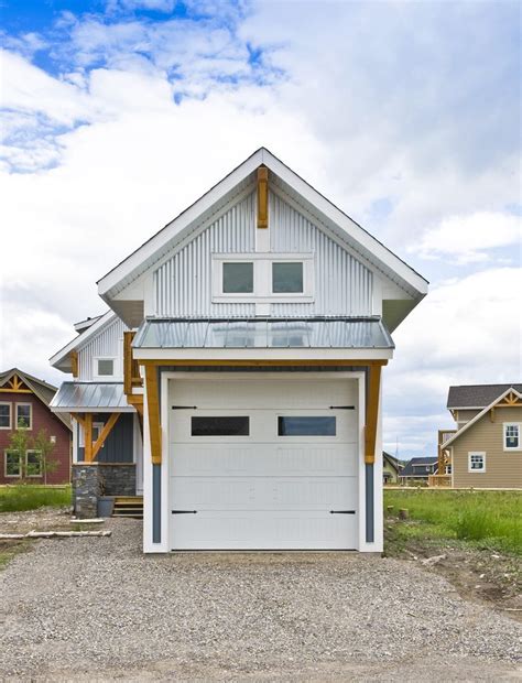 Our barn and garage building kits are designed with sturdy post and beam framing to easily stand up to the high winds and heavy snow common in new england. Vancouver Garage With Apartment Transitional with cabinet ...