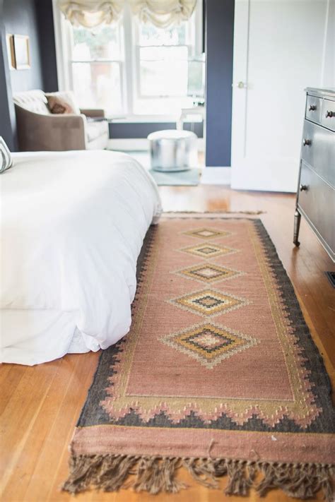 The bed is joined by a lovely night stand and has furry poufs at its foot! 37 Bedroom Rug Ideas - Best Bedroom Area Rugs For Your Home