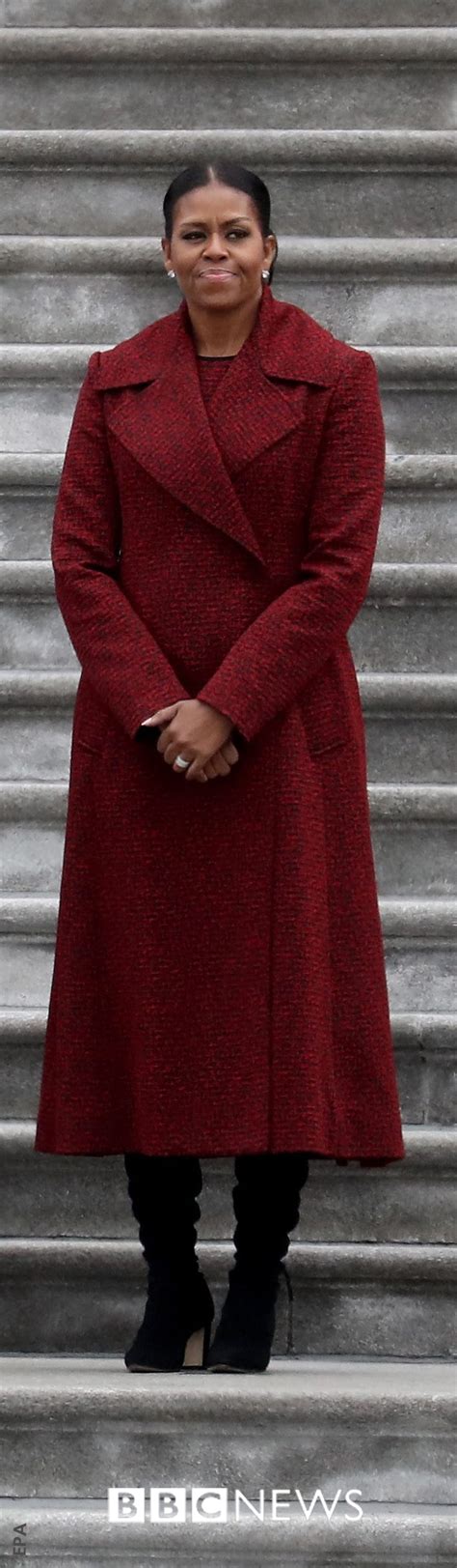Michelle Obama Wears A Striking Burgundy Coat And Boots As She Stands