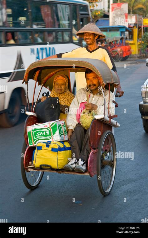 Passengers On A Becak Trishaw Bicycle Taxi Solo Java Indonesia Stock