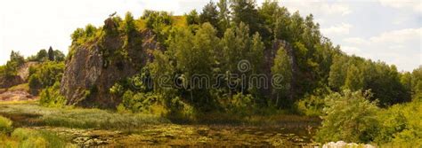 A Rocky Island Surrounded By Water Stock Photo Image Of Panorama