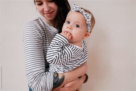 Woman And Baby Wearing Matching Outfits By Stocksy Contributor Pink