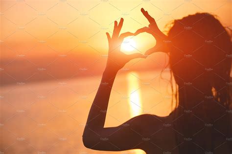 silhouette of a beautiful sexual girl against the sea and sunset ~ people photos ~ creative market