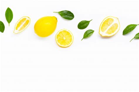 Lemon And Slices With Leaves Isolated On White Premium Photo