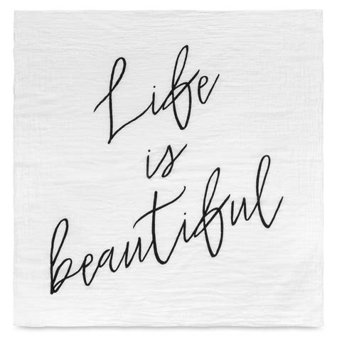 A Napkin With The Words Life Is Beautiful Written In Cursive Writing On It