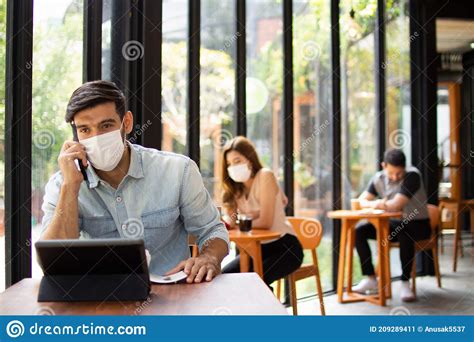 People Wearing Surgical Masks Are Sitting In Restaurants Coffee Shops