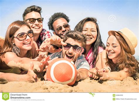 Group Of Multiracial Happy Friends Having Fun At Beach Games Stock