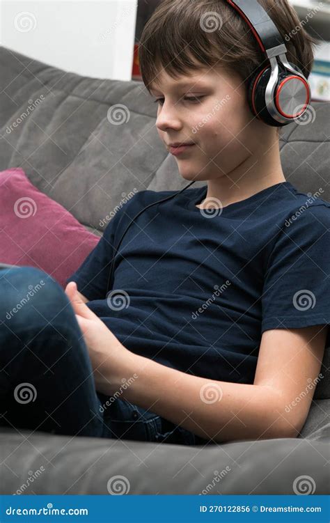 Portrait Of Happy Little Boy With Digital Tablet Computer Resting On