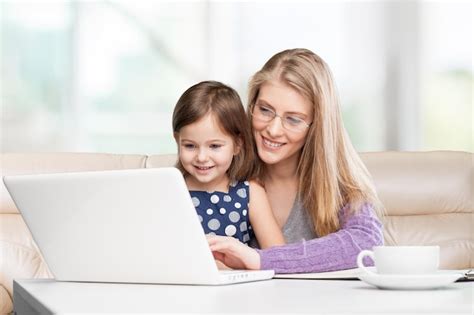 Premium Photo Busy Mother Working From Home With Daughter