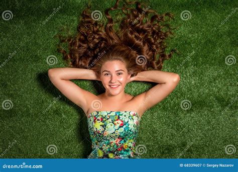 Portrait Of Pretty Smiling Young Woman Laying On The Grass Stock Image Image Of Grass Girl